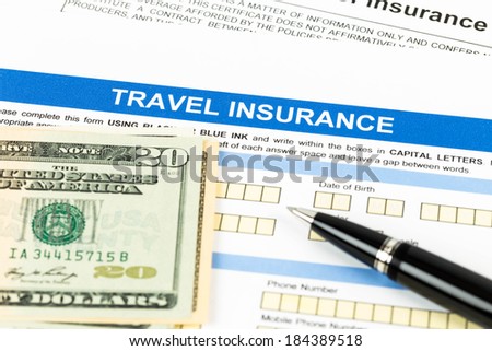 Travel insurance application form with pen model and dollar banknote