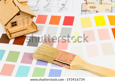 Paint color sample catalog with brush, drawing, and house model