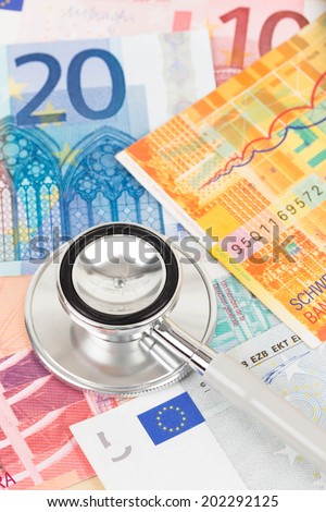Stethoscope on Europe banknote concept financial health check