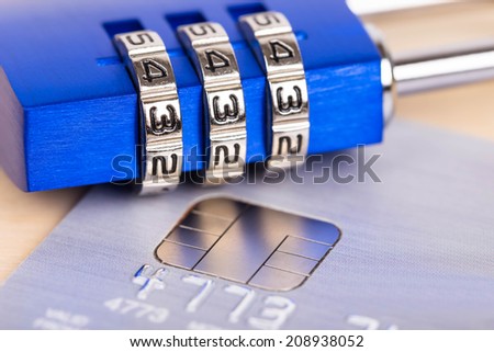 Combination padlock on credit card concept security