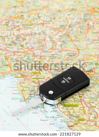 Car key on street map travel concept