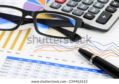 Marketing report chart or graph analysis with glasses, calculator, and pen