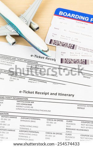 E-ticket with plane model, and boarding pass
