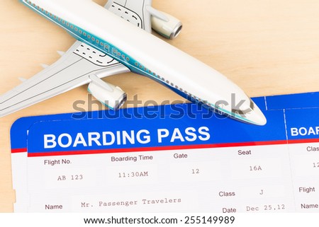 Boarding pass and plane model; boarding pass is mock-up