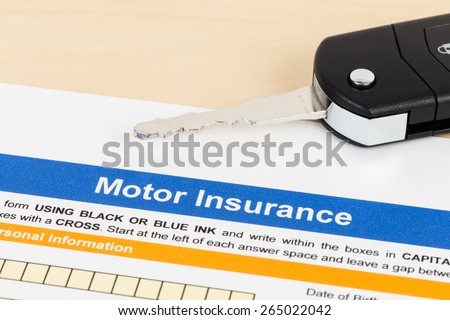 Motor or car insurance application with car key; document is mock-up