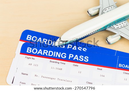 Boarding pass and plane model; boarding pass are mock-up