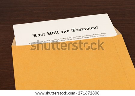 Last will on cream color paper with glasses and pen; document and information are mock-up