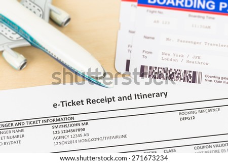 E-ticket with plane model, and boarding pass; these documents are mock-up