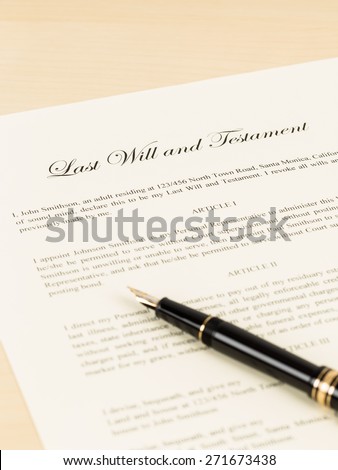 Last will on cream color paper with glasses and pen; document and information are mock-up