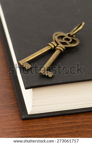 Antique key on book cover