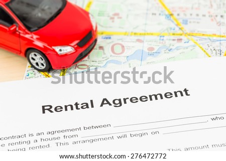 Car rental agreement on map; document is mock-up