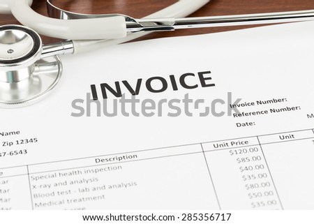 Invoice with stethoscope concept medical expense; document is mock-up