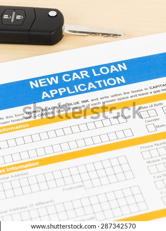 Car loan application with car key; form is mock-up