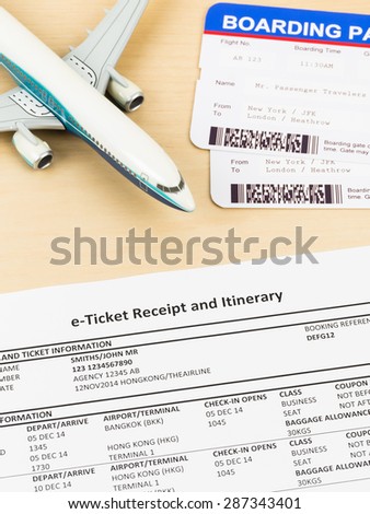 E-ticket with plane model, and boarding pass; e-ticket and boarding pass are mock-up