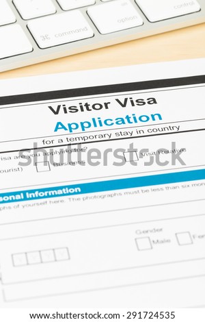 Visa application form with keyboard; form is mock-up