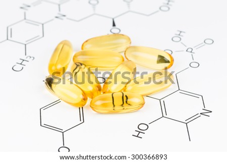 Fish oil capsule food supplement on vitamin formula
