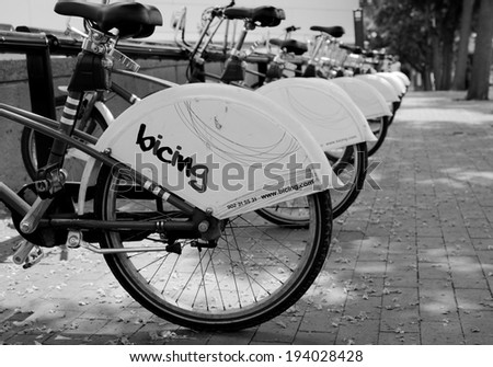 BARCELONA, SPAIN - June 29: Bicycles for rent in street on June 29, 2013 in Barcelona, Spain. Bicycle in Barcelona very popular transport
