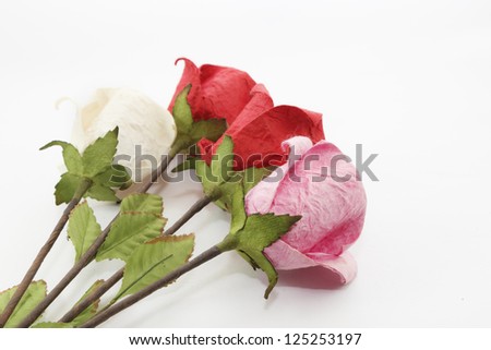Paper rose on white background