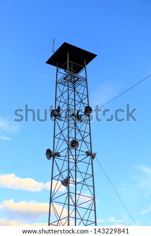 Speaker tower on blue sky