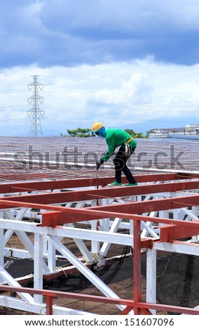 labor working in construction site  for roof prepare