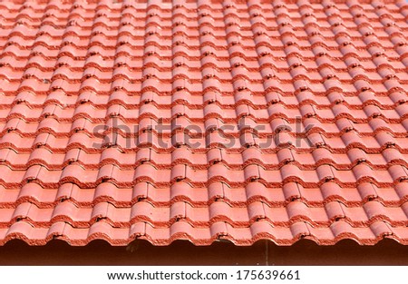 roof under construction with stacks of roof tiles for home building