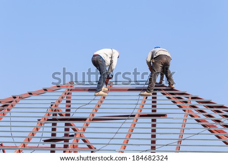 labor working in construction site for roof prepare