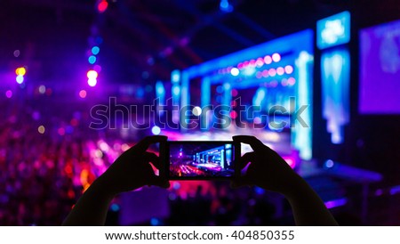 Take photo concert in front of stage