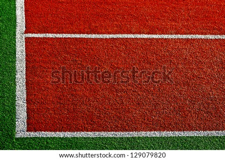 Sports field with synthetic turf and markings, used in tennis.Detail.