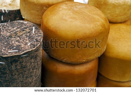 Cheese wrapped in fir bark and wheels of smoked cheese. Specific area Brasov, Romania.