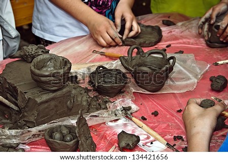 Children molding clay at a workshop held at the International Children's Day. Timisoara, Romania.