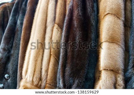 Fur coats made for ladies and exposed for sale.