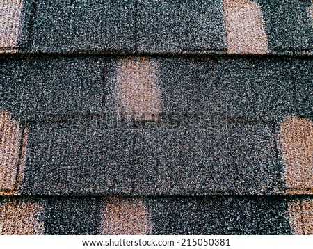 Colored asphalt roof structure that mimics the tiles.