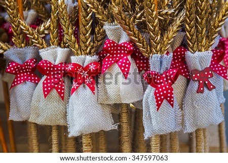 Winter decoration made of sticks wheat and bags with red knot, used during the Saint Nicholas day and night in December.