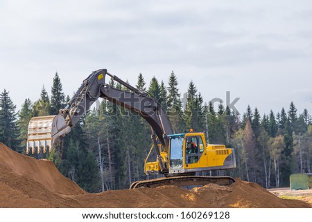 Yellow Construction Excavator at Work