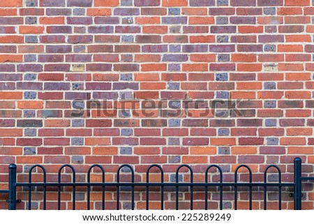 Brick wall background with fence