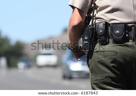 A police officer standing by traffic