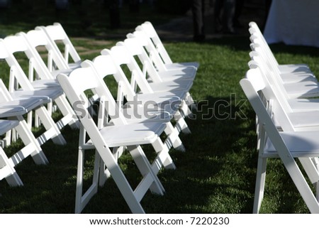 stock photo White chairs set up at a wedding outdoors