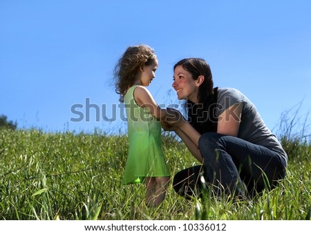 Mother and daughter in a field