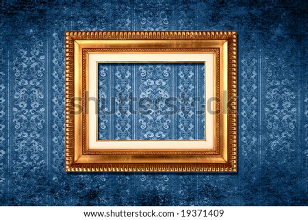 Vintage gold frame on blue grungy victorian wallpaper
