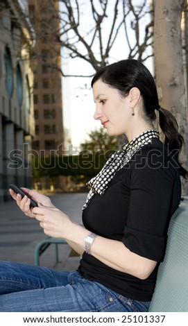 Casual business woman looking at her cell