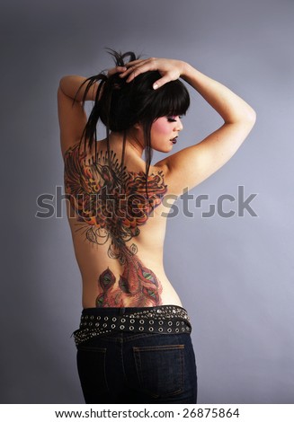 stock photo Beautiful woman with full back tattoo