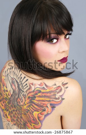 stock photo : Beautiful woman with full back tattoo