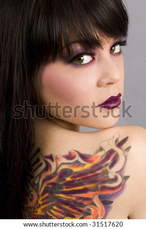 stock photo Beautiful exotic woman with colorful tattoo