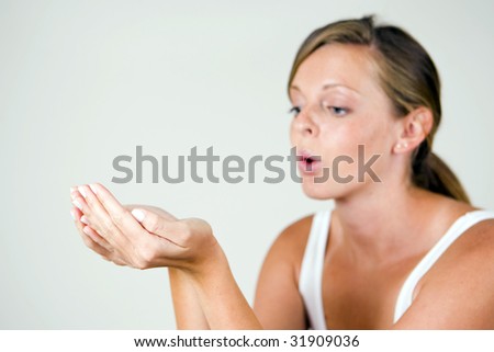 Woman holding empty hands out - focus on hands