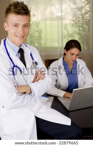 Friendly young medical professionals working in an office