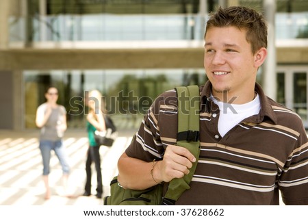 stock-photo-young-man-at-school-holding-a-book-bag-37628662.jpg