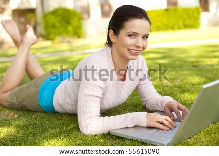 Young student using computer outside