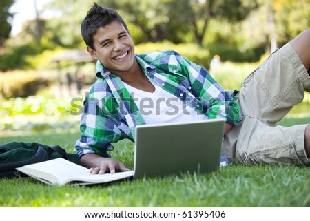 Student with backpack studying outside