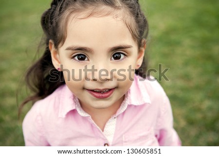 Cute little girl with big brown eyes