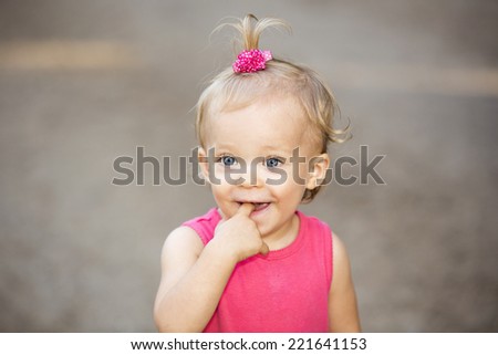 Cute little girl with a pink hair tie